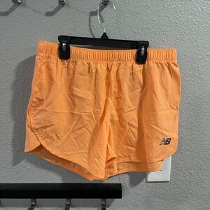 New Balance Women's Vibrant Orange Athletic Shorts